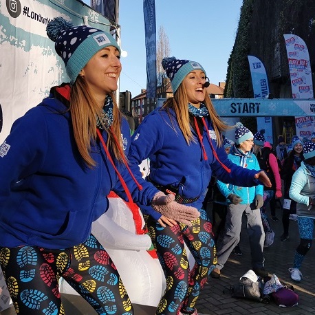 Two people cheering at challenge event