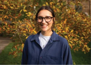 St Mungo's staff member smiling in a garden