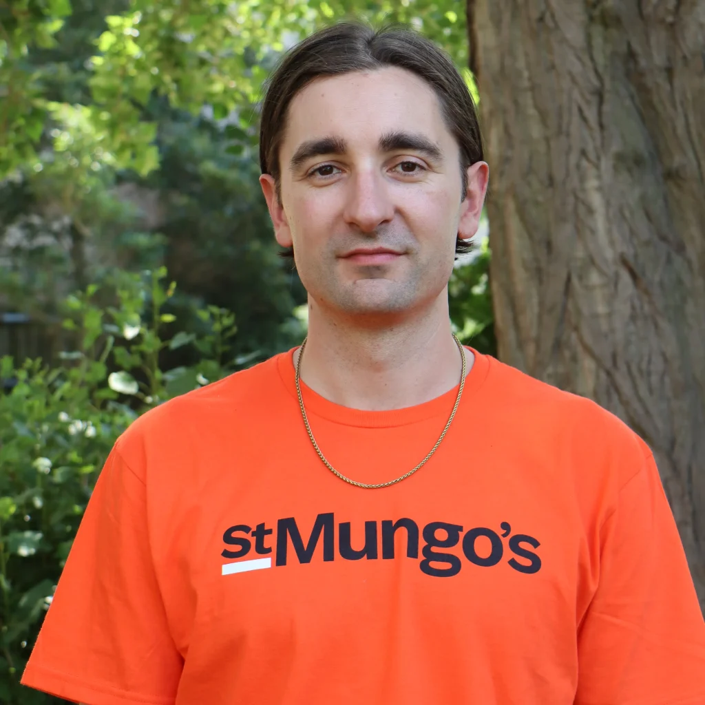 Gus Unger-Hamilton from the band alt-J wearing a St Mungo's t-shirt
