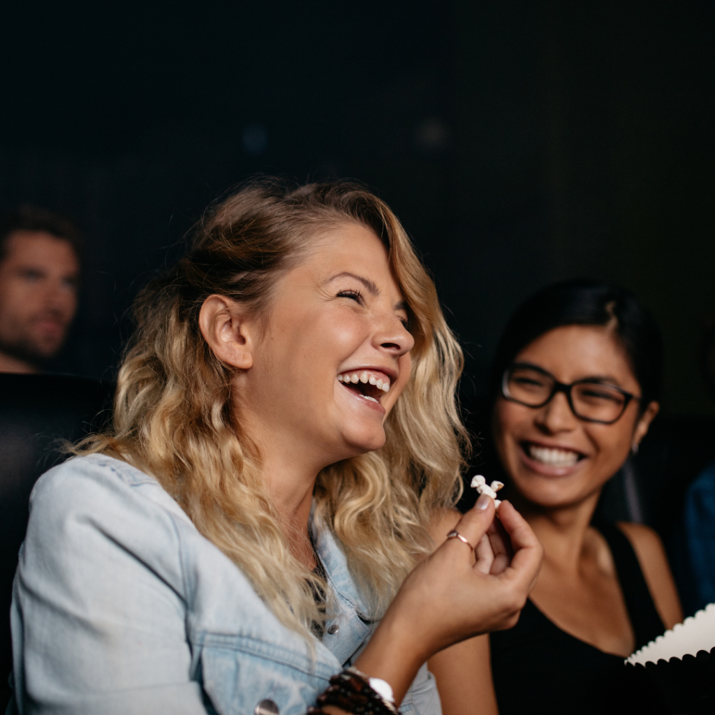 People laughing at a show